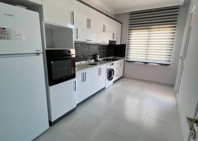 Furnished 4 + 1 Duplex Apartment with a Pool and a Charming Sea View