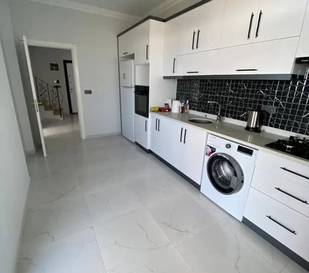 Furnished 4 + 1 Duplex Apartment with a Pool and a Charming Sea View