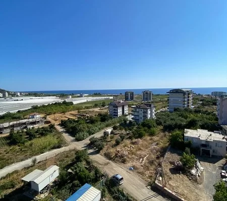 Furnished 4 + 1 Duplex Apartment with a Pool and a Charming Sea View