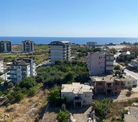 Furnished 4 + 1 Duplex Apartment with a Pool and a Charming Sea View