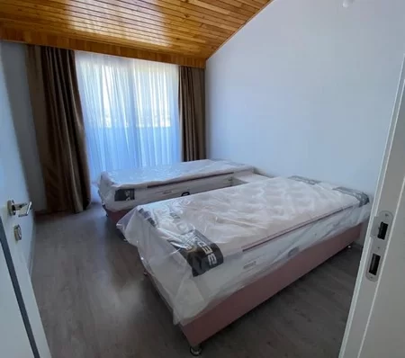 Furnished 4 + 1 Duplex Apartment with a Pool and a Charming Sea View