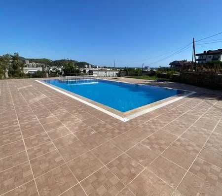 Furnished 4 + 1 Duplex Apartment with a Pool and a Charming Sea View